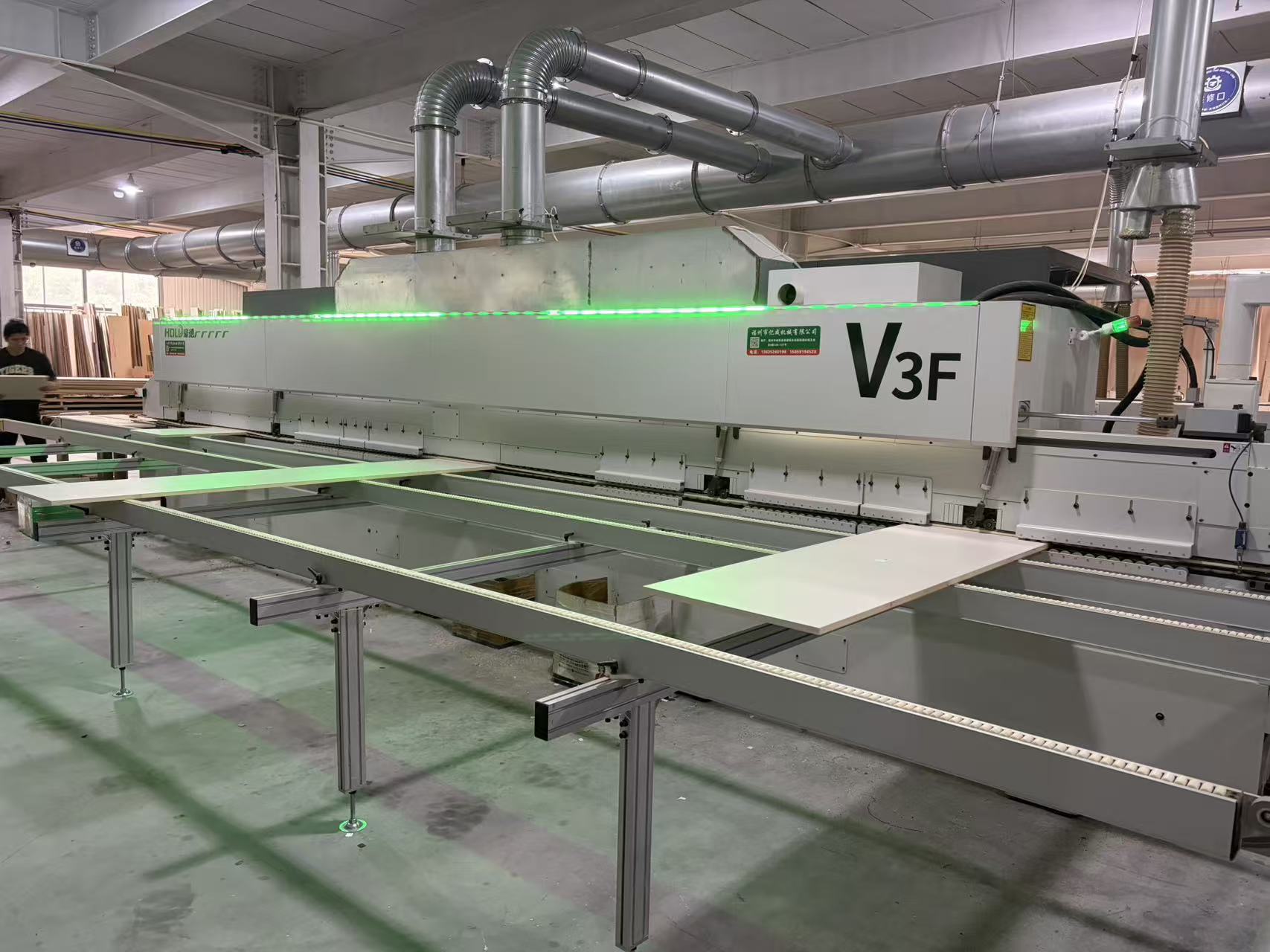 CNC router processing a furniture panel