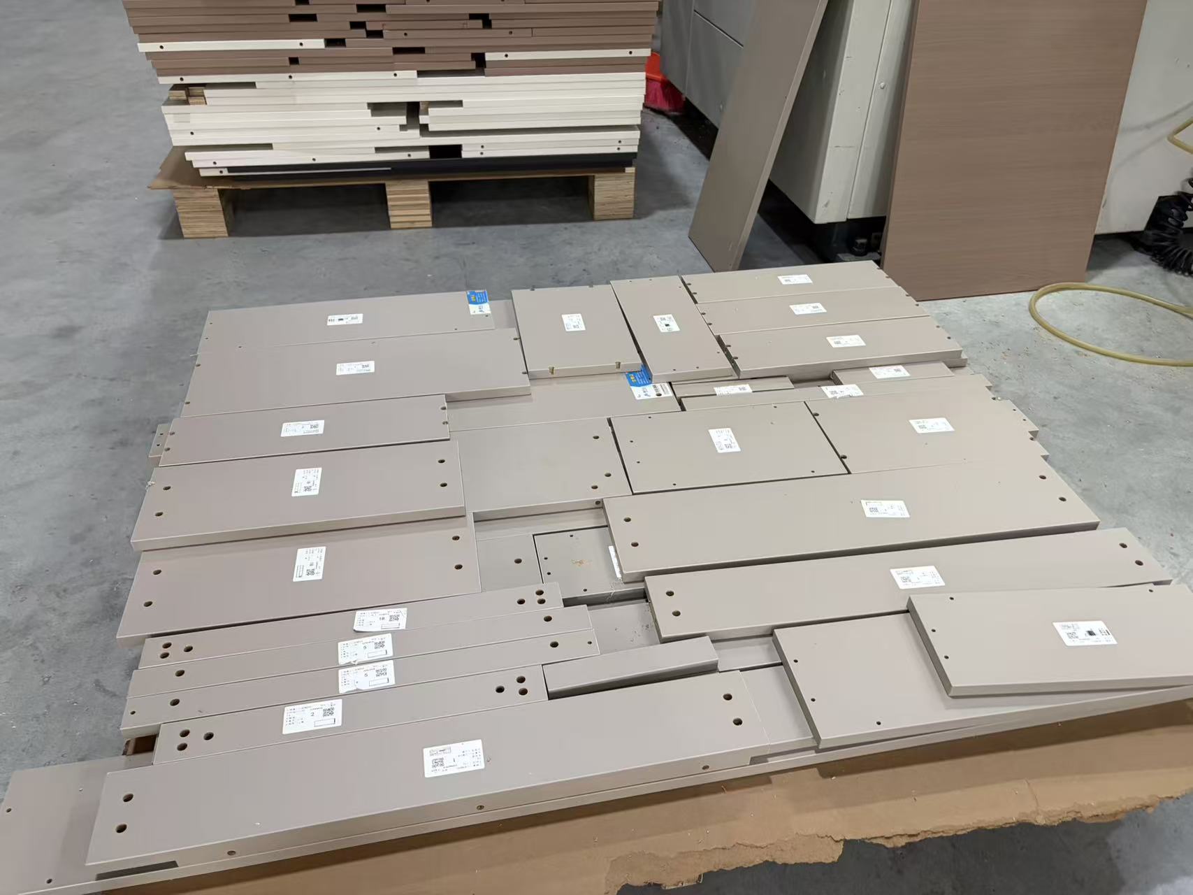 Cabinet parts labelled for pre-assembly and packing